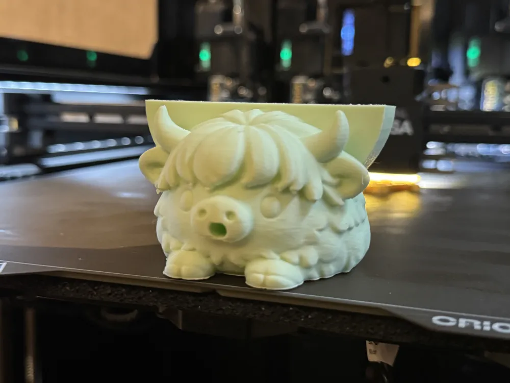 A real 3D print of Clyde the Highland Cow sponge holder