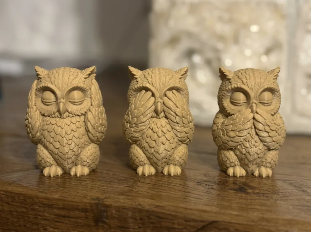 Three real 3D-printed owl figurines in hear, see and speak no evil poses